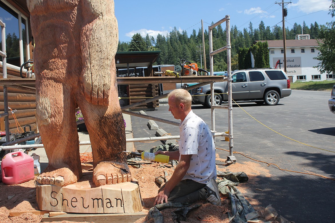 Photo by TANNA YEOUMANS
Hans Flynn began to torch Shelman as he neared the completion of the sculpture.