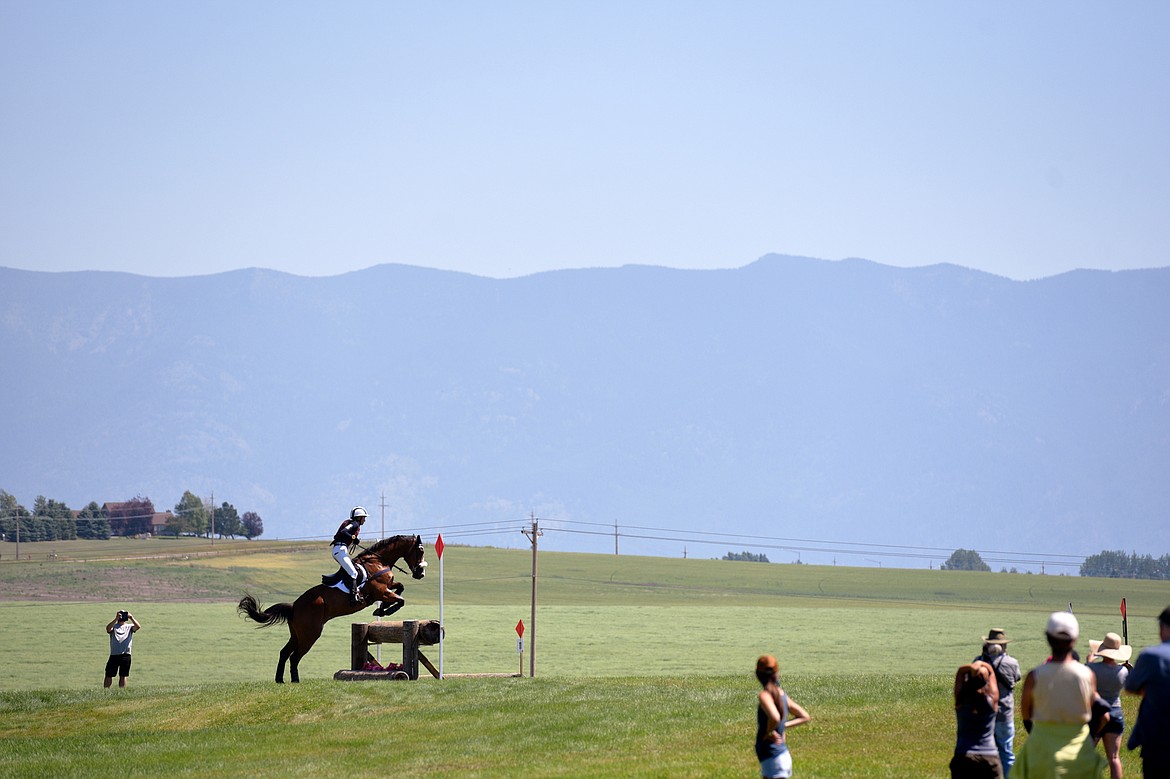 Emilee Libby on horse Jakobi clears a jump on the cross-country course during The Event at Rebecca Farm on Saturday. (Casey Kreider/Daily Inter Lake)