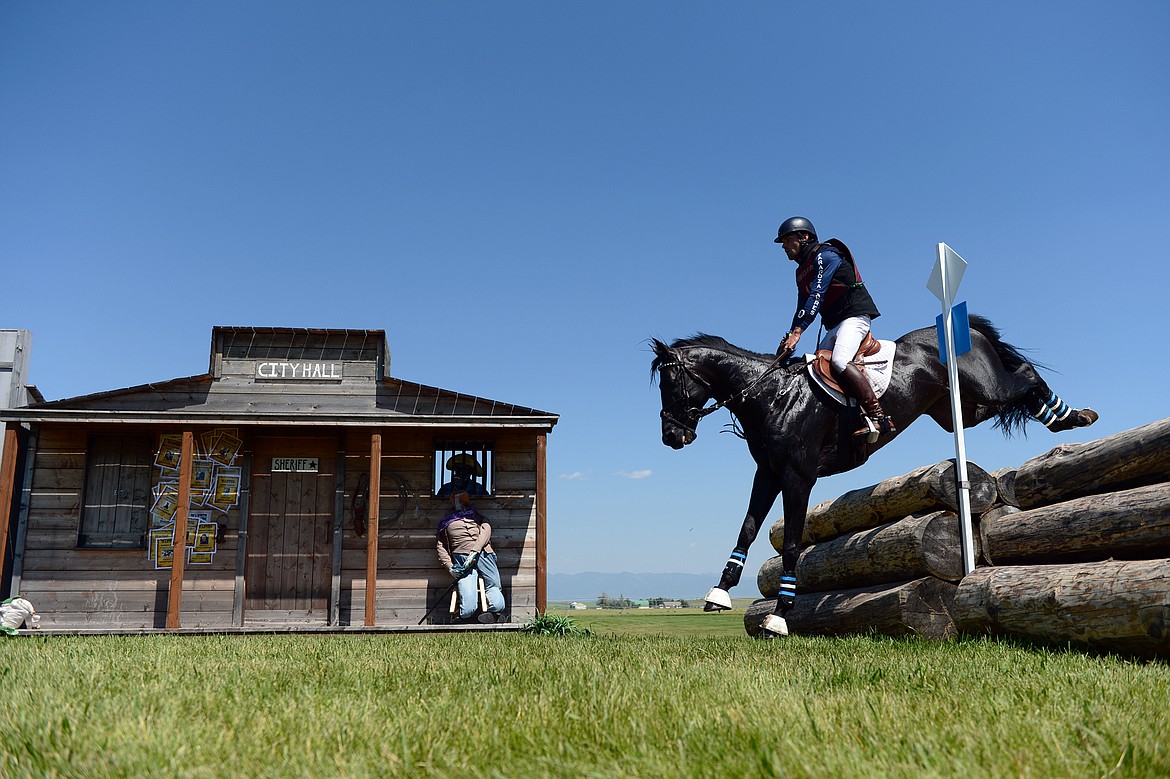 Chris Talley on horse Sandro's Star clears a jump in the &quot;Western Town&quot; area of the cross-country course during The Event at Rebecca Farm on Saturday. (Casey Kreider/Daily Inter Lake)