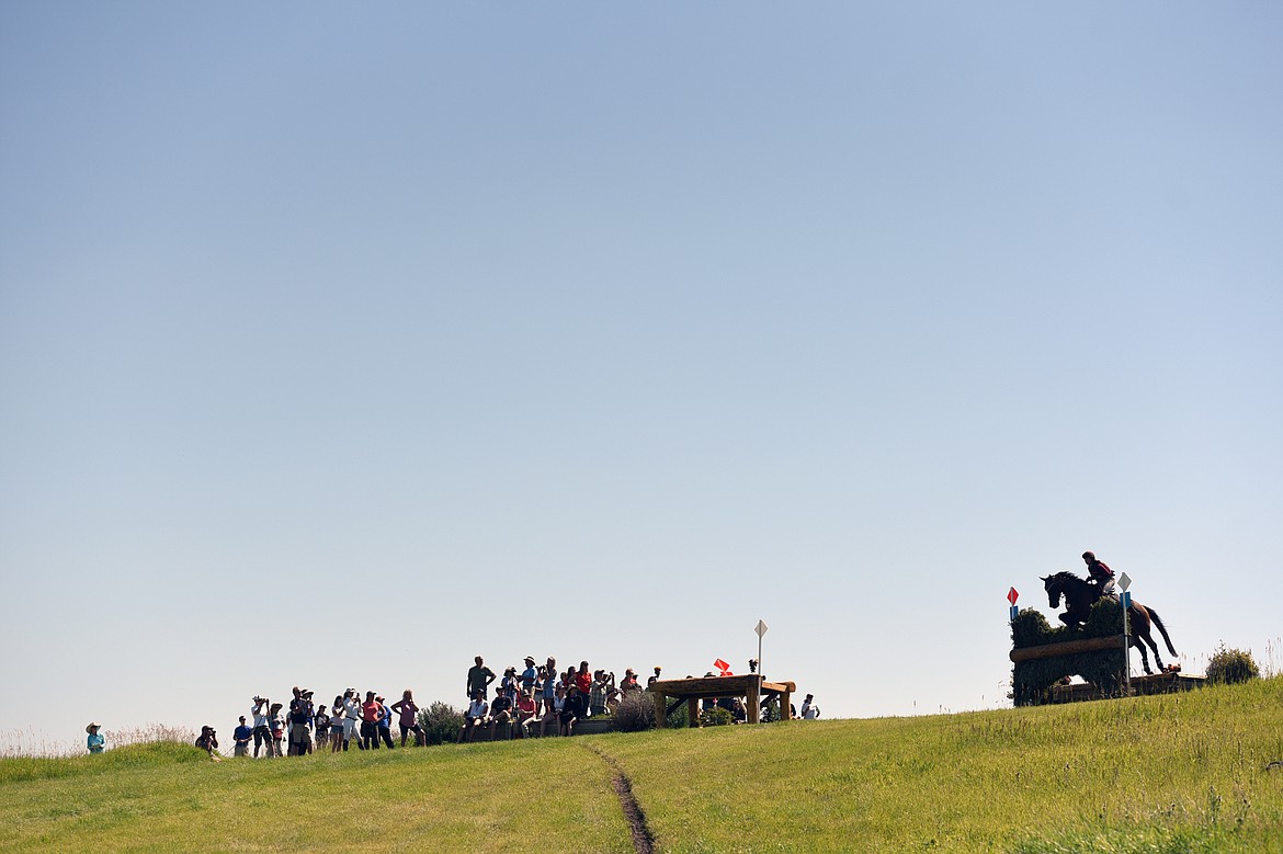 Sabrina Glaser and horse Rembrandt clear a jump on the cross-country course's Spectator Hill during The Event at Rebecca Farm on Saturday. (Casey Kreider/Daily Inter Lake)