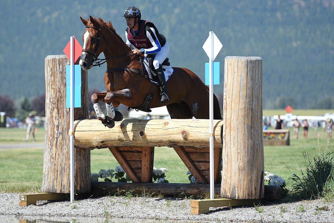 Alexis Helffrich on horse London Town clears a water jump on the cross-country course during The Event at Rebecca Farm on Saturday. (Casey Kreider/Daily Inter Lake)