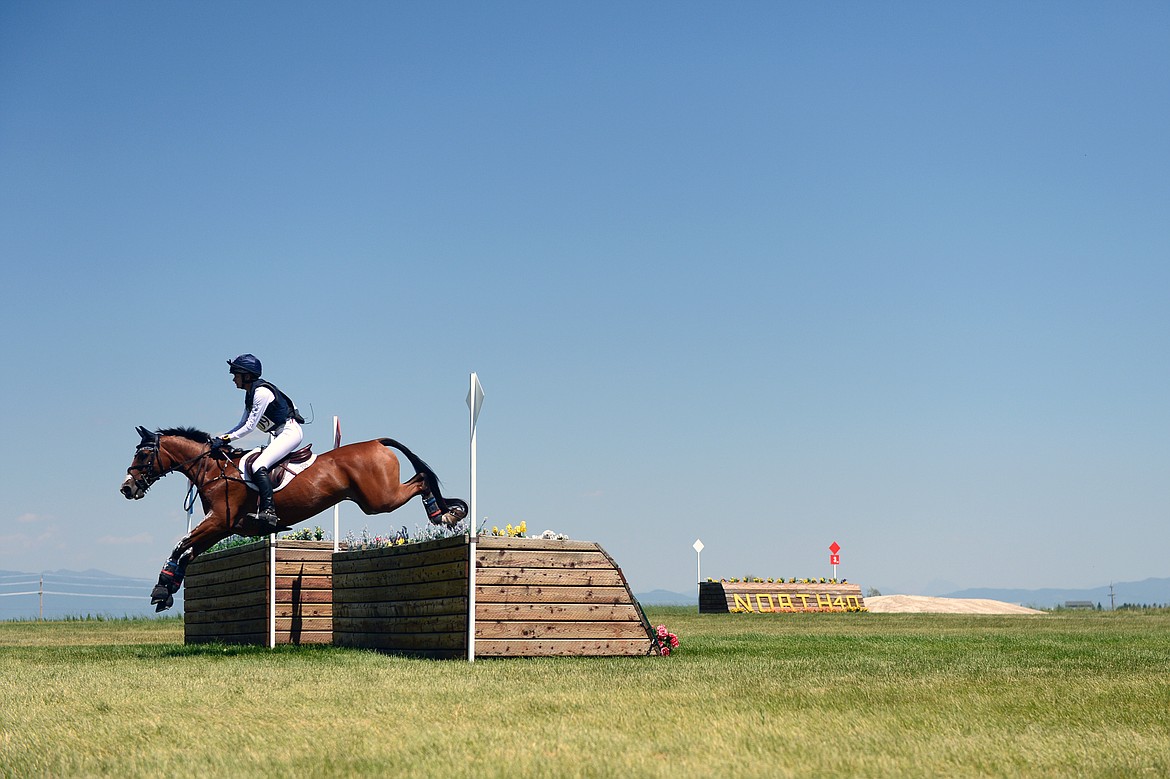 Olivia Wall on horse Mandolin R clears a jump on the cross-country course during The Event at Rebecca Farm on Saturday. (Casey Kreider/Daily Inter Lake)