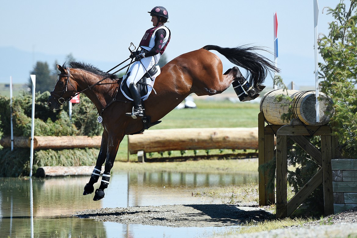 Kristen Bond on horse Enough Already clears a water jump on the cross-country course during The Event at Rebecca Farm on Saturday. (Casey Kreider/Daily Inter Lake)