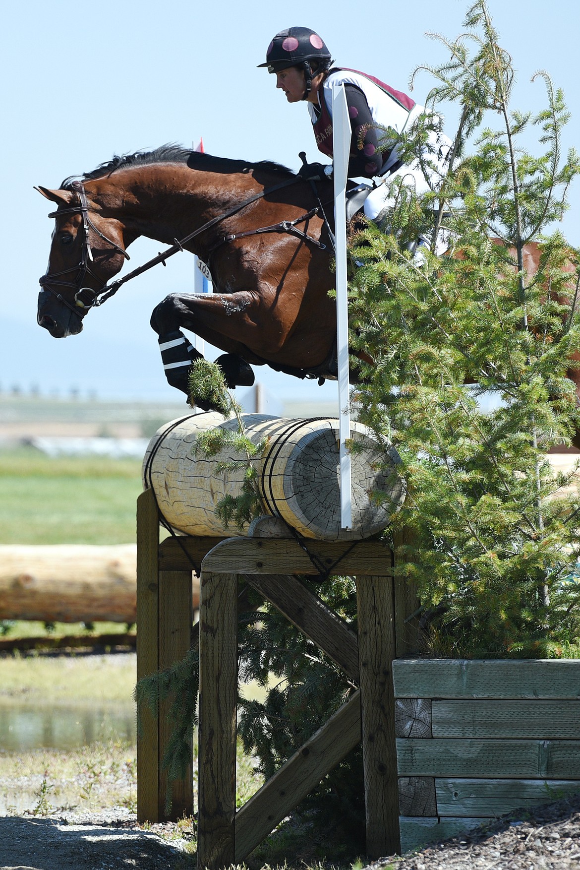 Kristen Bond on horse Enough Already clears a water jump on the cross-country course during The Event at Rebecca Farm on Saturday. (Casey Kreider/Daily Inter Lake)