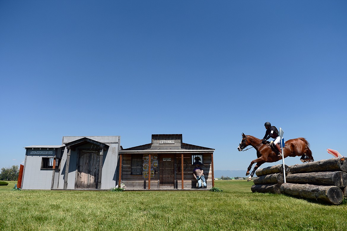 Robert Meyerhoff on horse Rascal Rap clears a jump in the &quot;Western Town&quot; area of the cross-country course during The Event at Rebecca Farm on Saturday. (Casey Kreider/Daily Inter Lake)