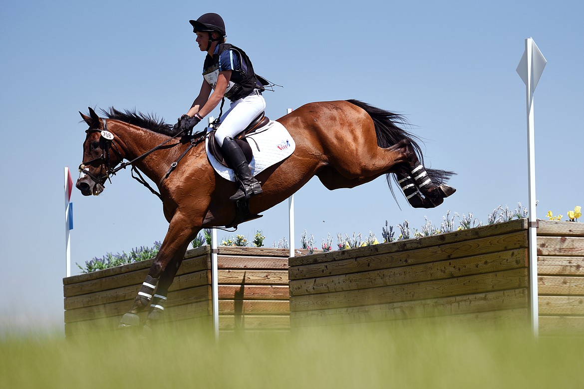 Blake Park on horse Factor Five clears a jump on the cross-country course during The Event at Rebecca Farm on Saturday. (Casey Kreider/Daily Inter Lake)