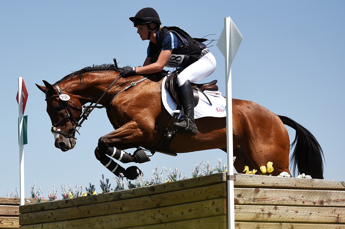 Blake Park on horse Factor Five clears a jump on the cross-country course during The Event at Rebecca Farm on Saturday. (Casey Kreider/Daily Inter Lake)