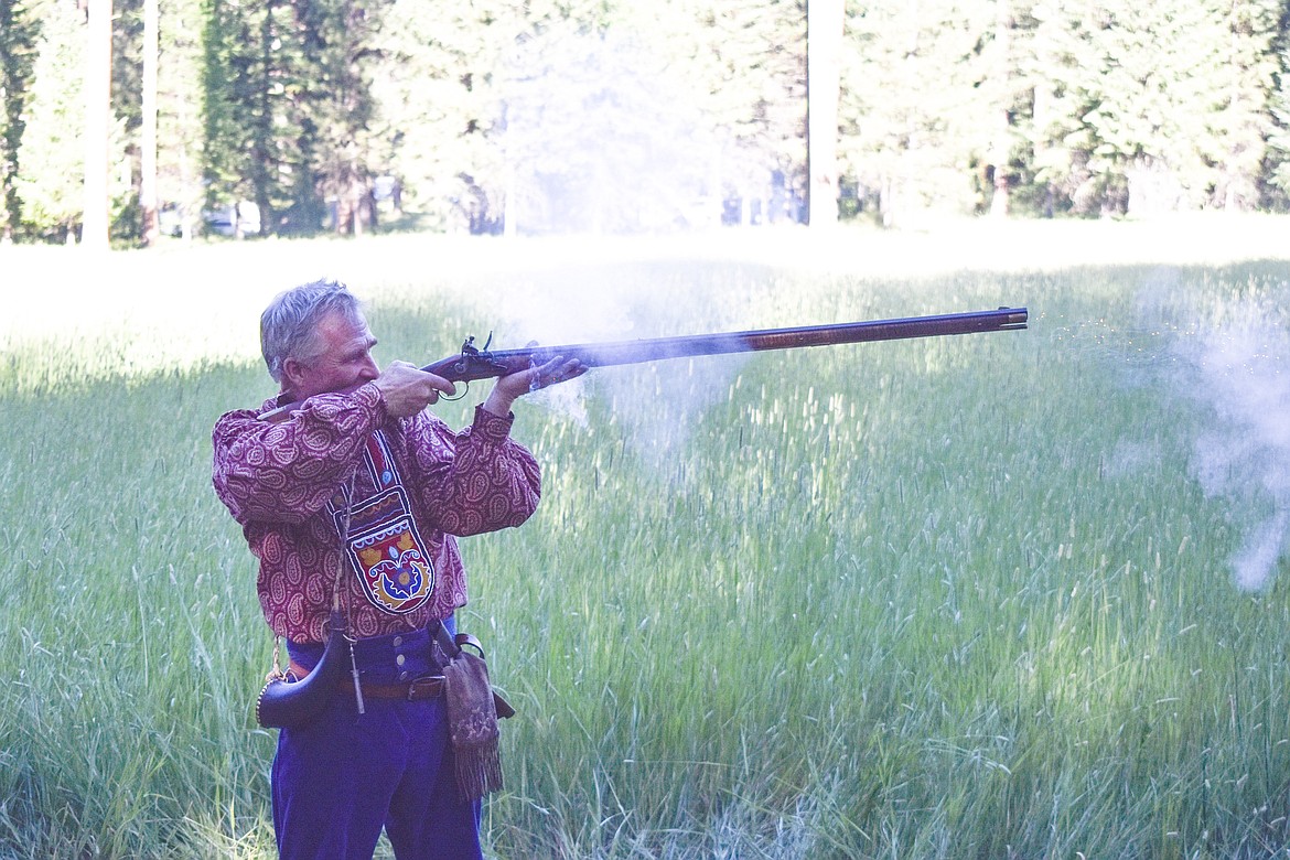 Rod Douglas fires a muzzleloader during the Two Rivers Rendezvous near Libby July 14. (Ben Kibbey/ The Western News)
