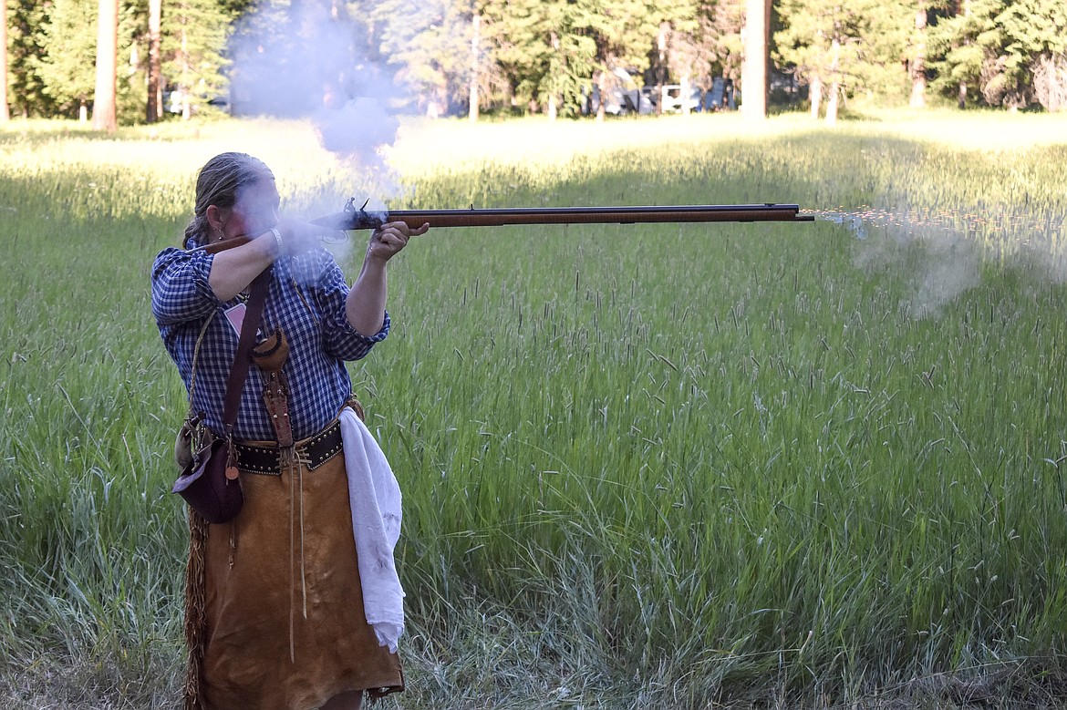 Shawntel &#147;Healer Woman&#148; Yost, a registered nurse who earned her nickname from seeing to first aid during such events, fires a muzzleloader during the Two Rivers Rendezvous near Libby July 14. (Ben Kibbey/ The Western News)