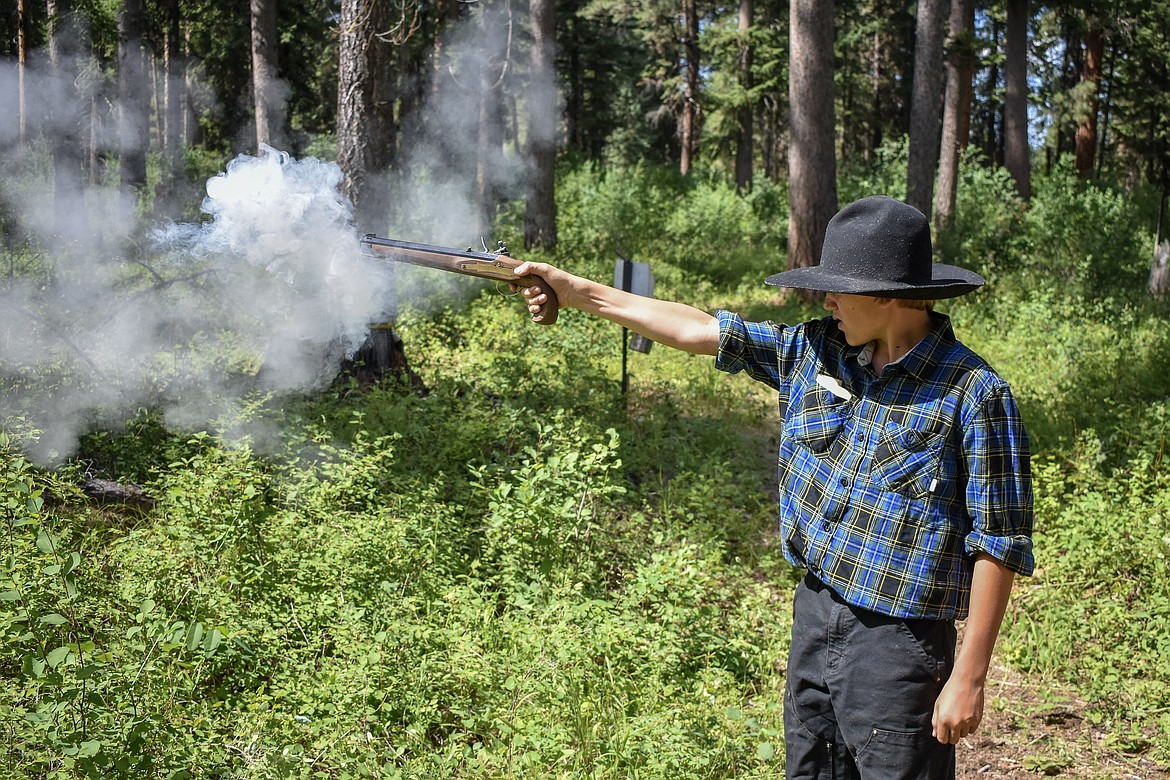 Camren Horner fires a pistol during the Two Rivers Rendezvous near Libby July 14. (Ben Kibbey/ The Western News)