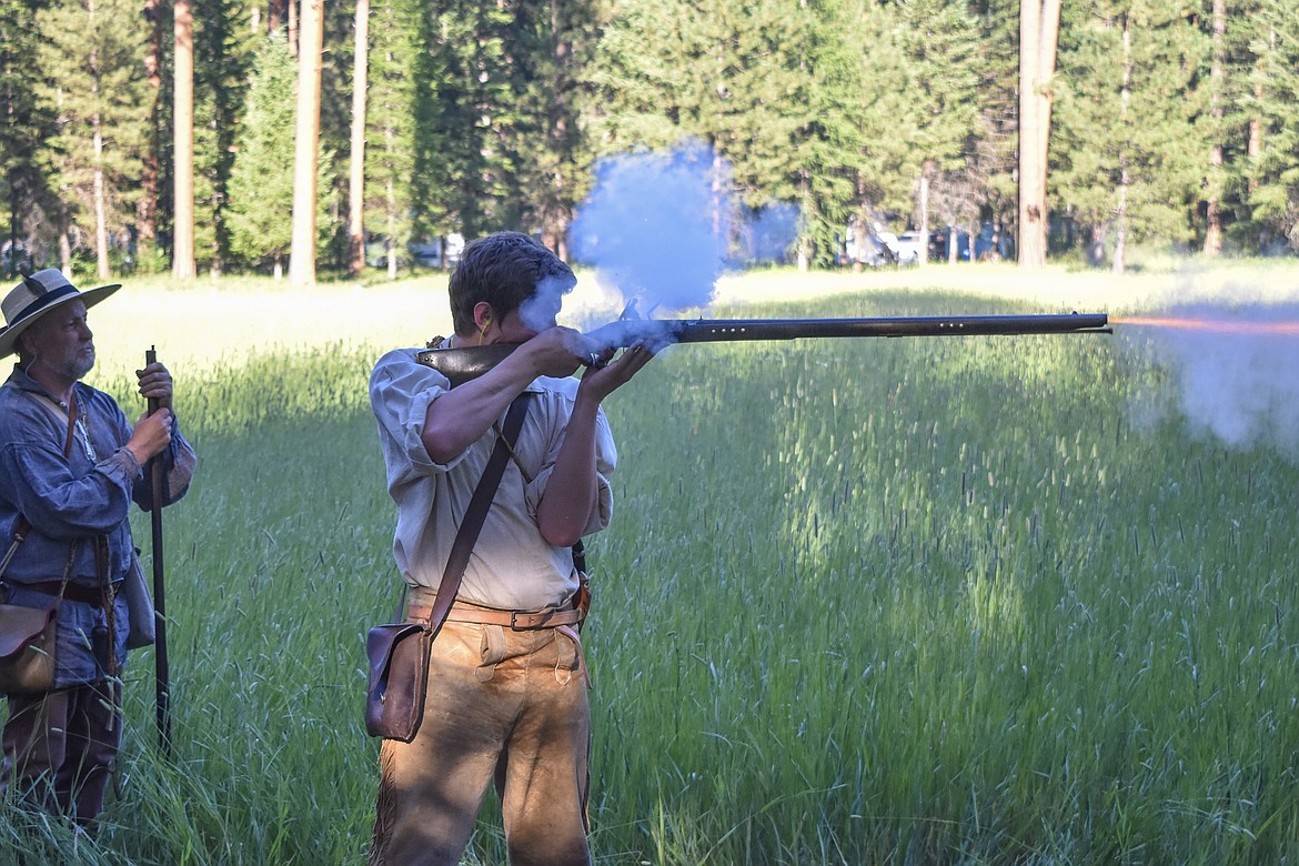 Sean McQueen fires a muzzleloader during the Two Rivers Rendezvous near Libby July 14. (Ben Kibbey/ The Western News)