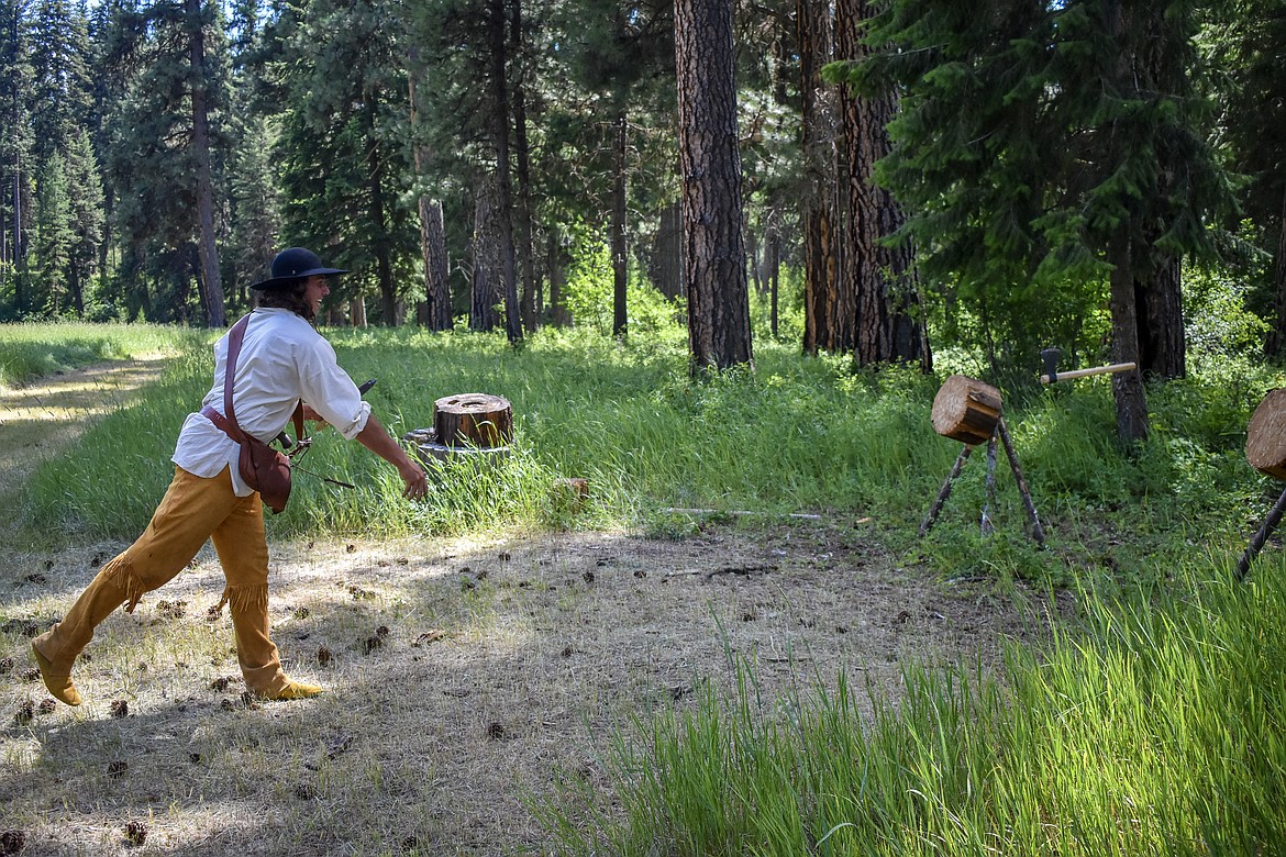 Trevor Horner practices his tomahawk throw during the Two Rivers Rendezvous near Libby July 14. (Ben Kibbey/ The Western News)