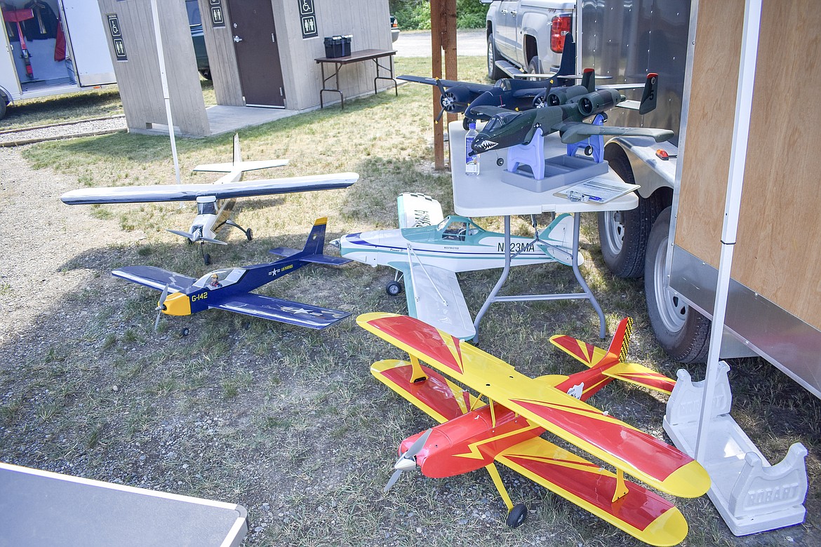 A variety of radio control planes set out between flights during the annual Kootenai RC Flyers Fun Fly July 14 at the RC airport off Champion Haul Road. (Ben Kibbey/The Western News)