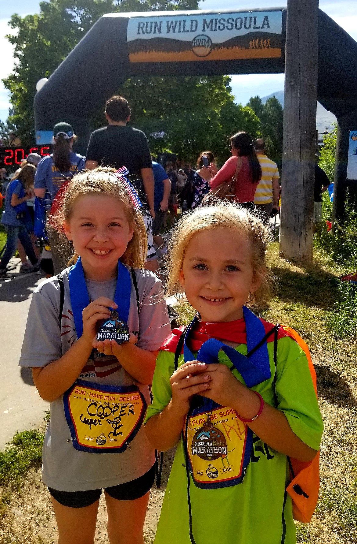 Kendall and Cooper Spurr show off their medals after the kids&#146; marathon in Missoula recently.