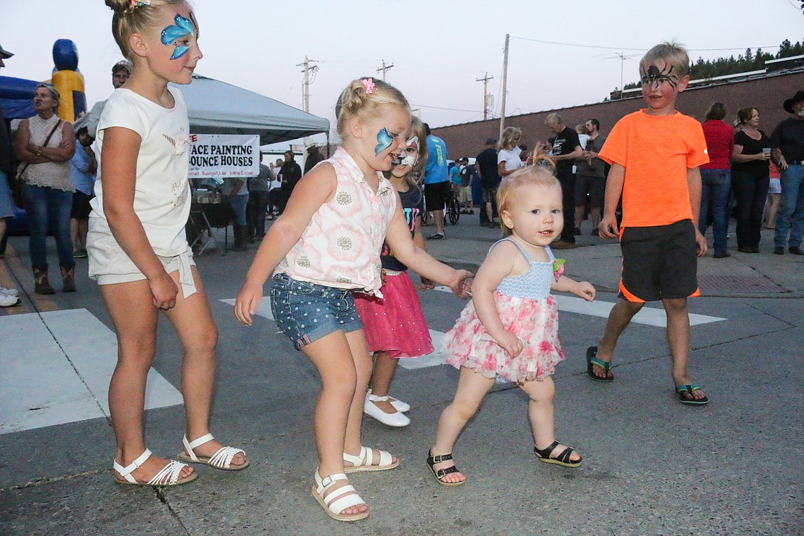 Photo by MANDI BATEMAN
With freshly painted faces, the children were the first to populate the dance floor.