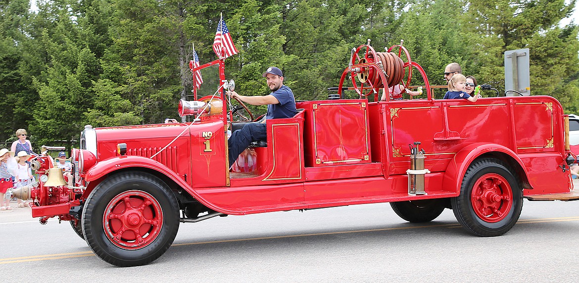 The 1929 GMC was driven in this year&#146;s parade by Lieutenant Kody Kelley with honorary member #799 three-year-old Addy Trevino and her family in the back. (Courtesy Seeley Swan Pathfinder)