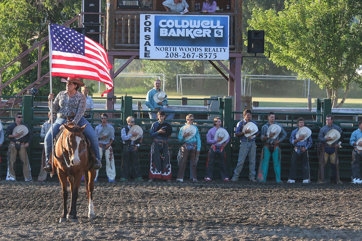 Photo by MANDI BATEMAN
Hats off for the national anthem.