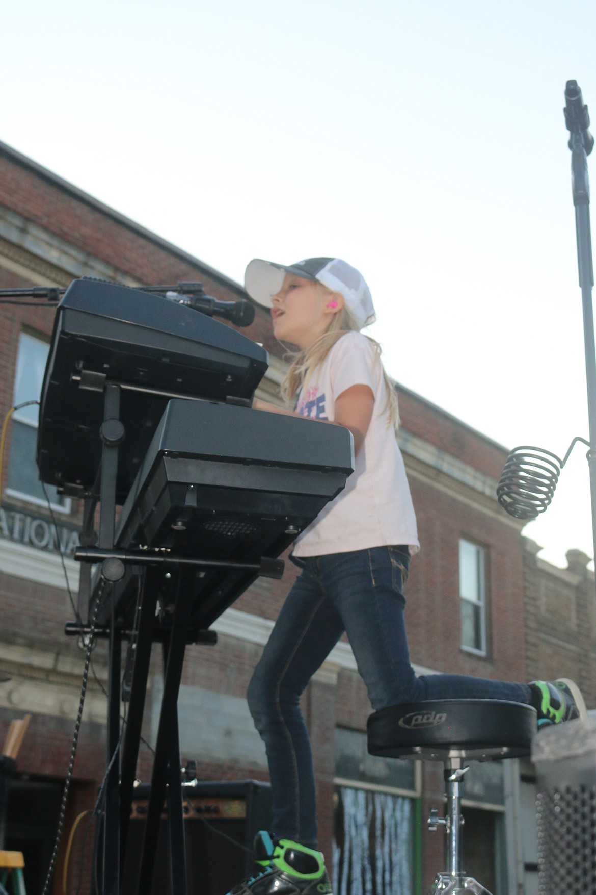 Photo by MANDI BATEMAN
A crowd favorite, singer and keyboard player from the Family Seed performs the opening act for the street dance.