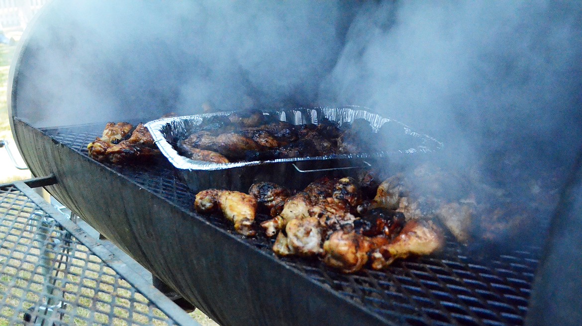 Chicken legs were grilling away at the Chicken Jamboree. (Erin Jusseaume/ Clark Fork Valley Press)