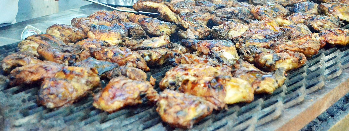 Don Burrell kept the grill hot as he cooked hundreds of pounds of chicken for the Chicken Jamboree. (Erin Jusseaume/ Clark Fork Valley Press)