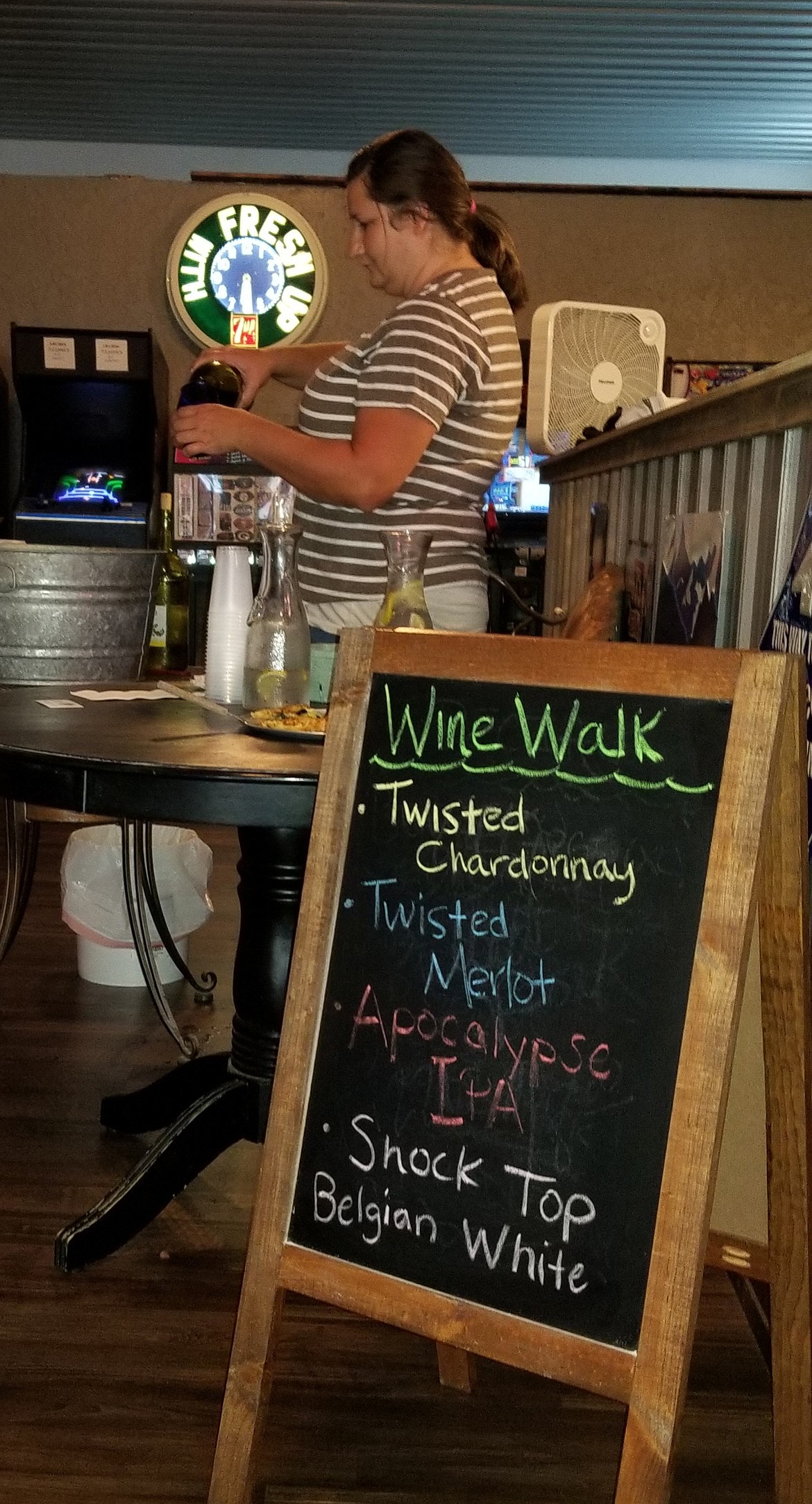 Photo by MANDI BATEMAN
Serving people during the Wine Walk at Goat Mountain Pizzeria.