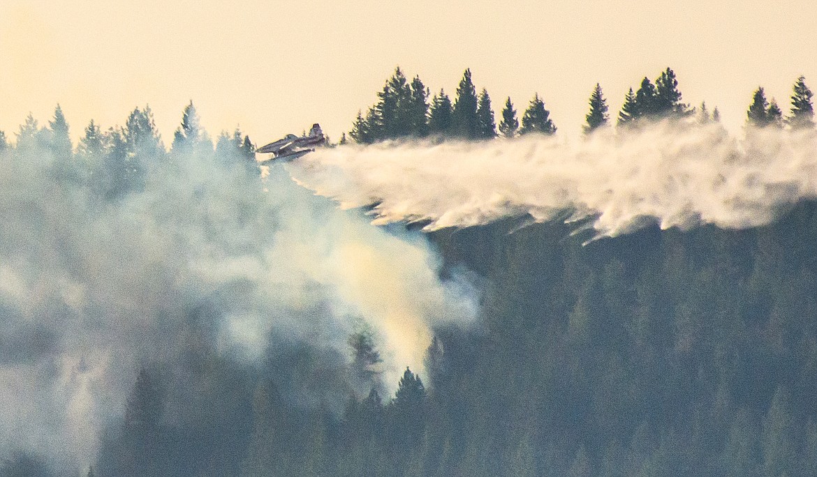 A firefighting plane does precision water drop on fire. (CHRIS CHAFFEE/Courtesy photo)