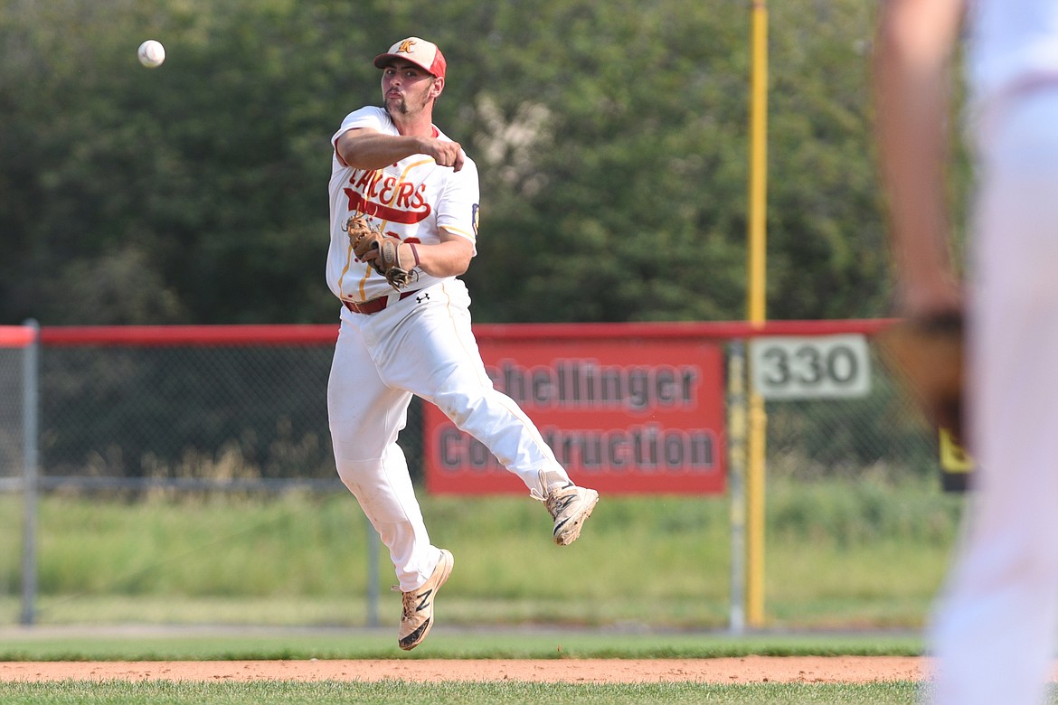 Kalispell Lakers AA third baseman Dawson Smith ranges to his left to throw out Billings Scarlets Jarron Wilcox on an infield grounder in the fifth inning of the Class AA state tournament at Griffin Field on Tuesday. (Casey Kreider/Daily Inter Lake)