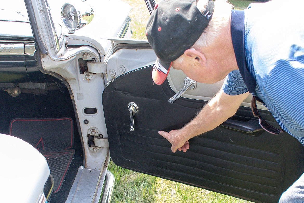 Jesse James points out the &#147;Ranger&#148; logo on his 1959 Edsel Ranger Saturday during the RMV Auto Car Show south of Libby. (Ben Kibbey/The Western News)