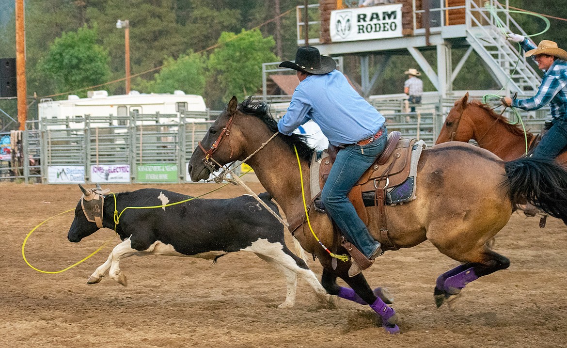 Travis Winters, from Joliet, and Jacob Goddard, from Billings, rope their steer to win the team roping event during the 2018 Kootenai River Stampede Saturday (Ben Kibbey/The Western News)