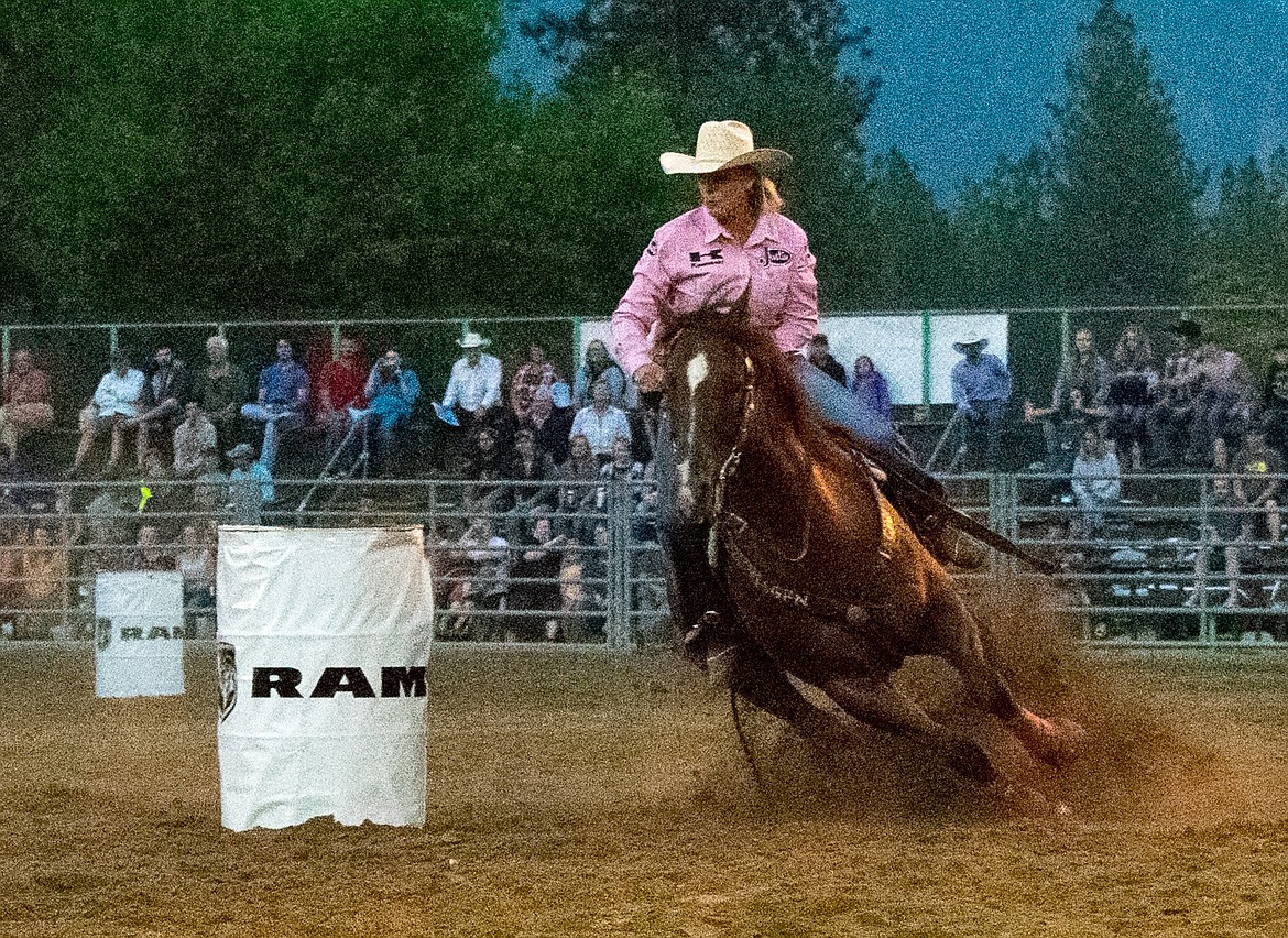 Mary Walker, from Ennis, Texas, swings her horse around the barrel during the barrel racing competition, winning with a 17.67, at the 2018 Kootenai River Stampede PRCA Rodeo Saturday (Ben Kibbey/The Western News)