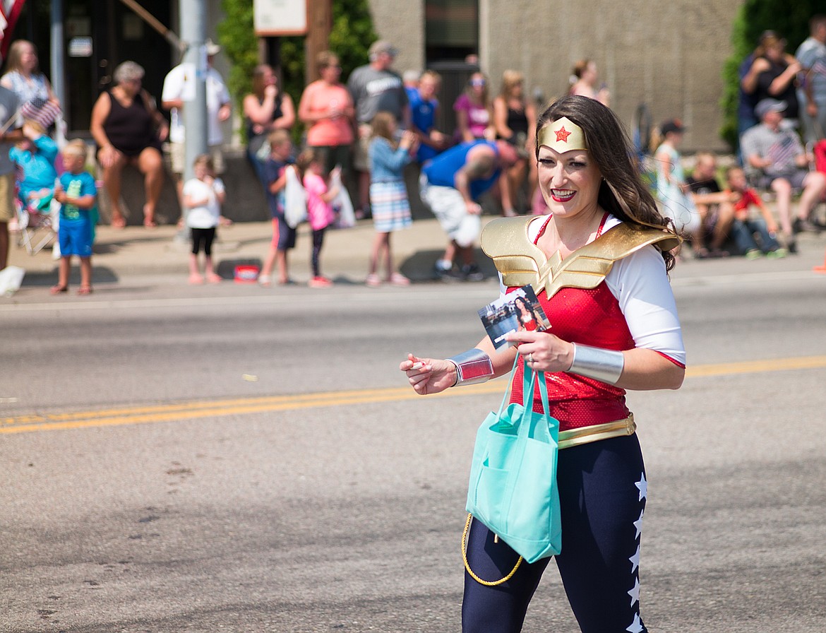 Wonder Woman hands out candy.