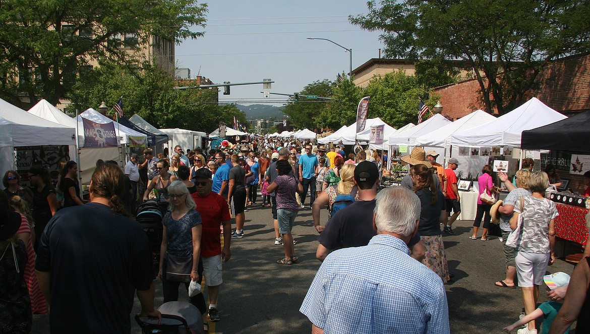 Thousands of people took advantage of Saturday&#146;s moderate temperatures to enjoy the Downtown Street Fair, shown here, Art on the Green and the Taste of Coeur d&#146;Alene. The events conclude today from 10 a.m. to 5 p.m. (BRIAN WALKER/Press)