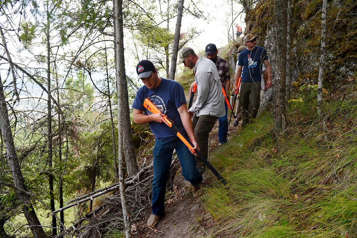 Game wardens with Montana Fish, Wildlife &amp; Parks look for signs of an animal attack during a training simulation at Lone Pine State Park on Thursday, July 26. (Casey Kreider/Daily Inter Lake)