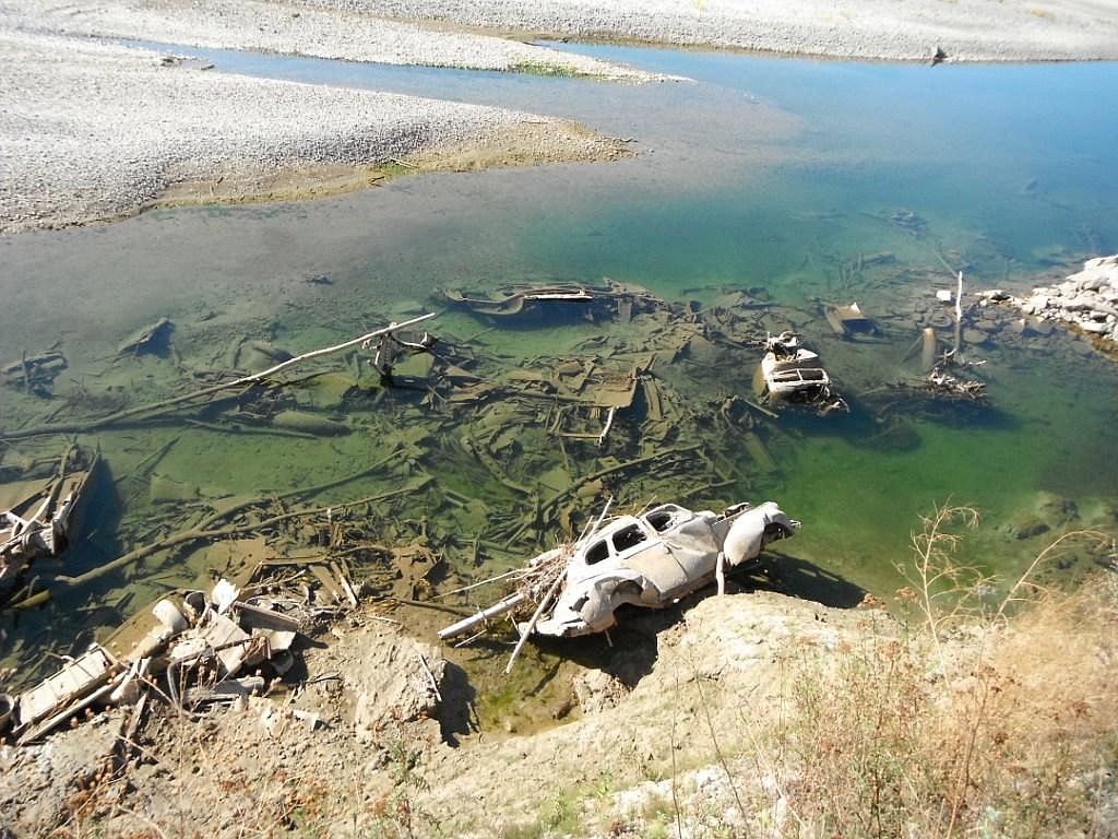 Car bodies at base of north bank of the Koot-enai River.