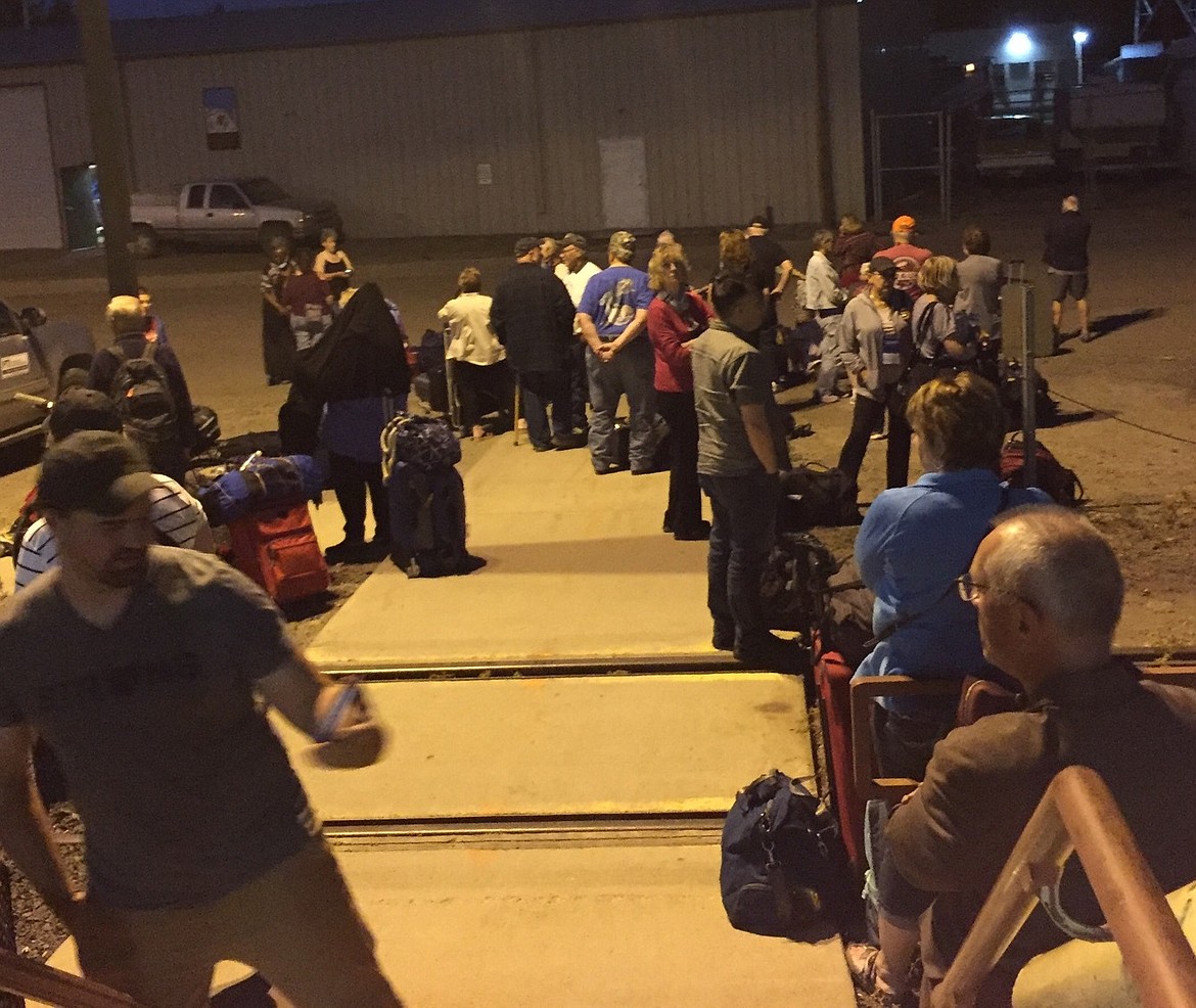 PASSENGERS MILLED around for several hours at the depot in Shelby while waiting for bus transportation to Whitefish.