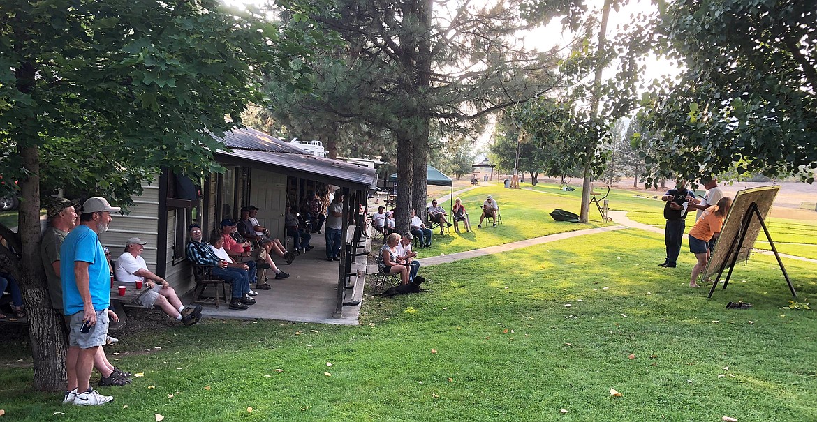 Everyone got into the spirit of the Calcutta on Saturday evening for the Bruce Frye Memorial. (Erin Jusseaume/ Clark Fork Valley Press)