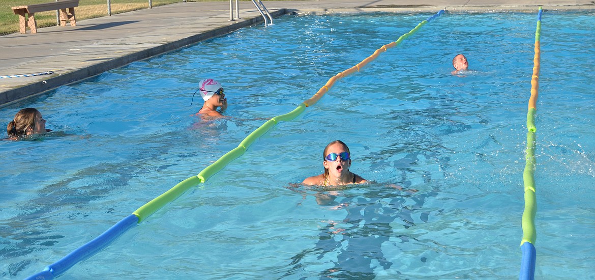 The Plains pool was filled with Piranhas and their sidekicks swimming laps during the fundraiser. (Erin Jusseaume/ Clark Fork Valley Press)