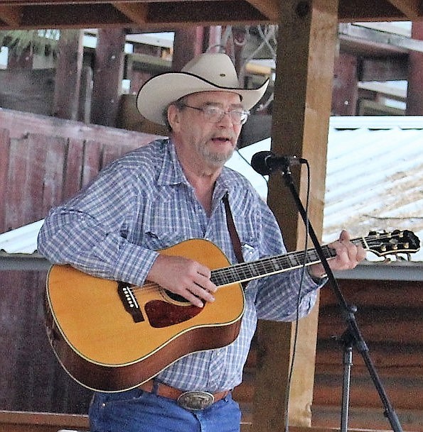Gary Redman played guitar and sang a country tune for first place in the adult category of the Talent Show held Saturday afternoon at the county fair in Superior.
