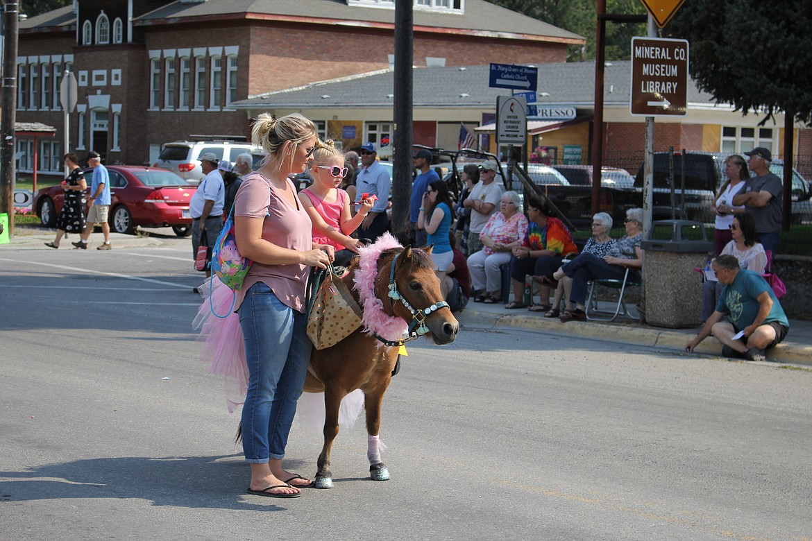 HARPER FRAWLEY and her mom, Kaila, took first place for their pretty-in-pink-pony at the county fair parade on Saturday.