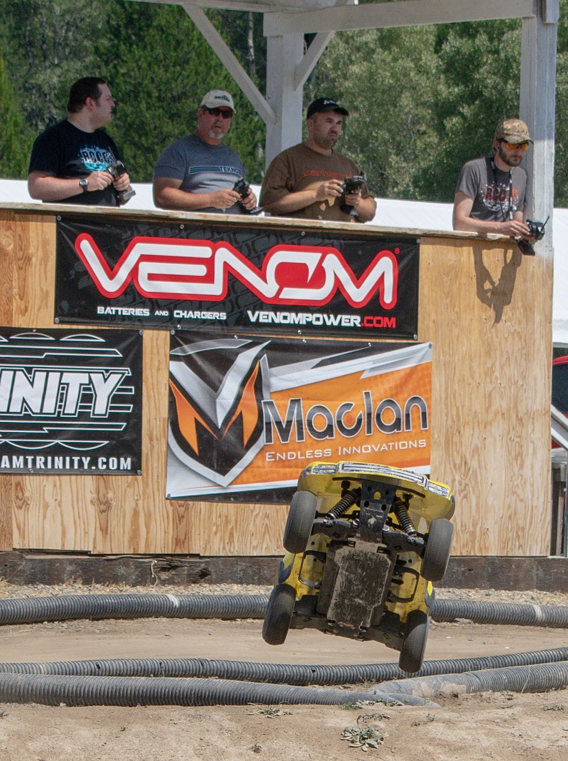 His eyes on his car, David Robinson works the controls from the drivers&#146; stand as he guides his four wheel drive &#147;truck&#148; RC racer over jumps during final races of the Kootenai RC Racers&#146; Hot August Showdown on Sunday. (Ben Kibbey/The Western News)