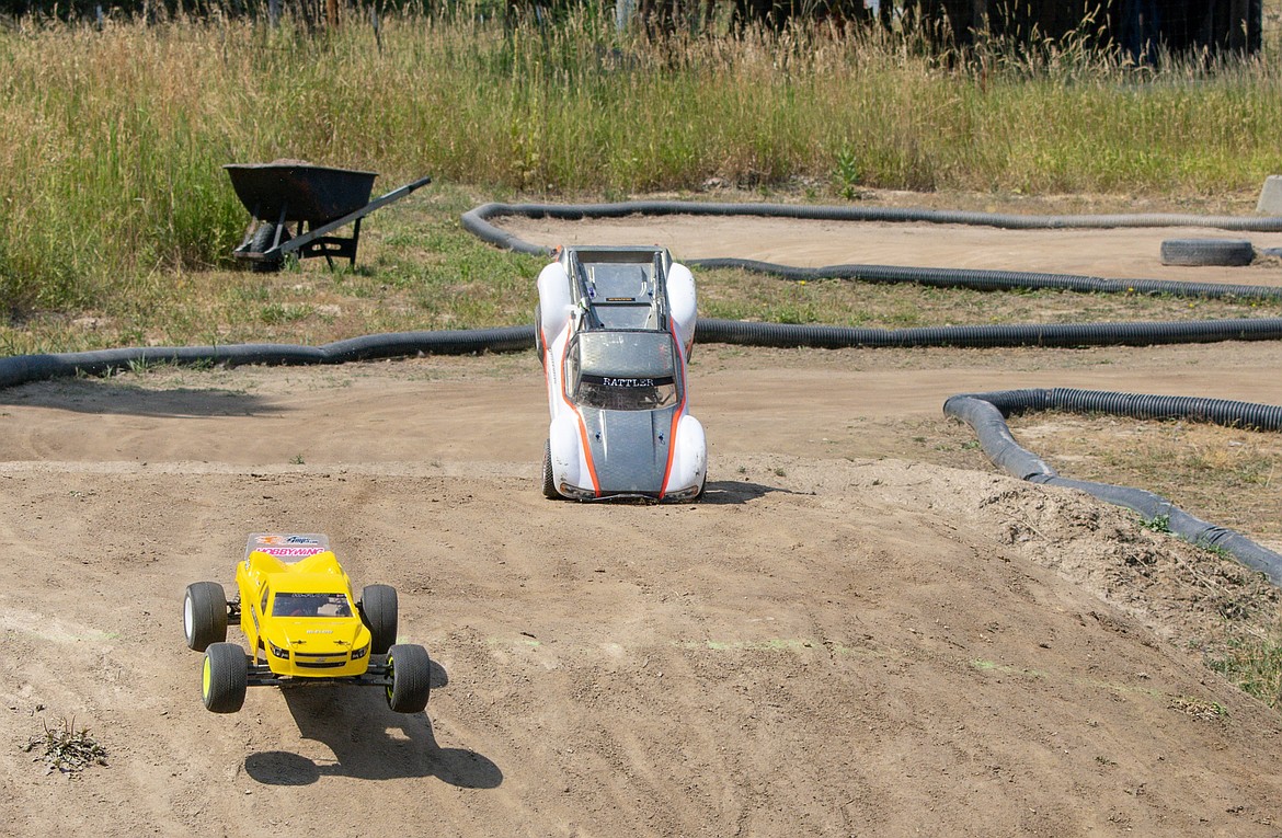 Along with the thrills, there were a few spills during final races of the Kootenai RC Racers&#146; Hot August Showdown on Sunday. &#147;Marshalls&#148; stationed around the course run out to right cars when they collide, flip or leave the track. (Ben Kibbey/The Western News)