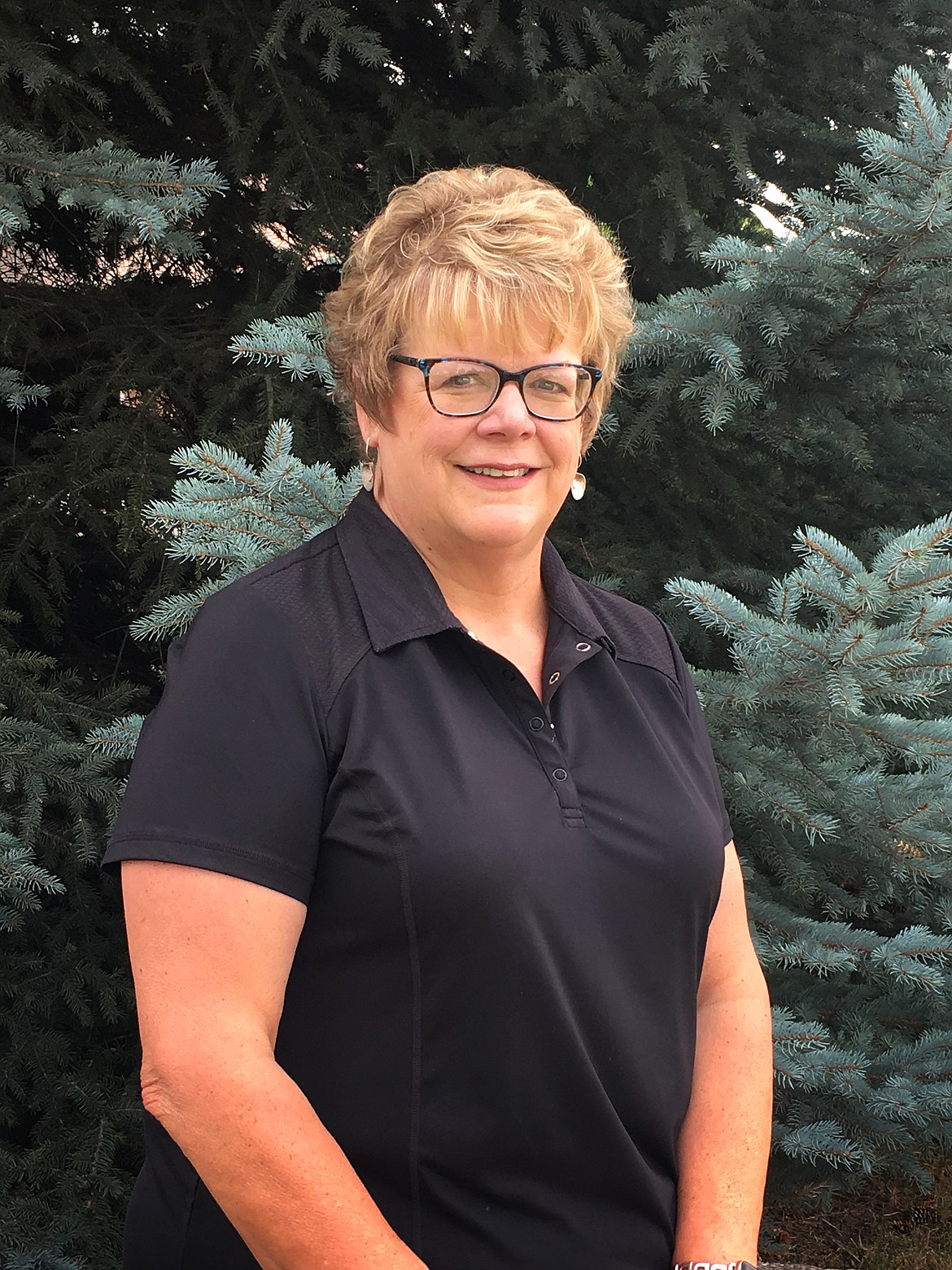 Donna Lawson poses outside of the Bigfork Chamber of Commerce office. (Mackenzie Reiss/Daily Inter Lake)