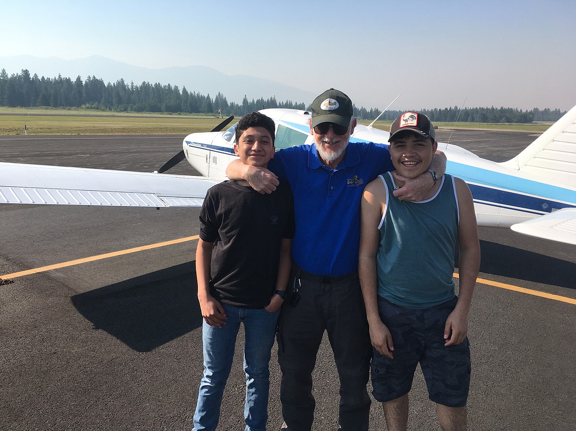 Roberto Ramirez, Young Eagles Pilot Ray Rose, and Luis Duarte.