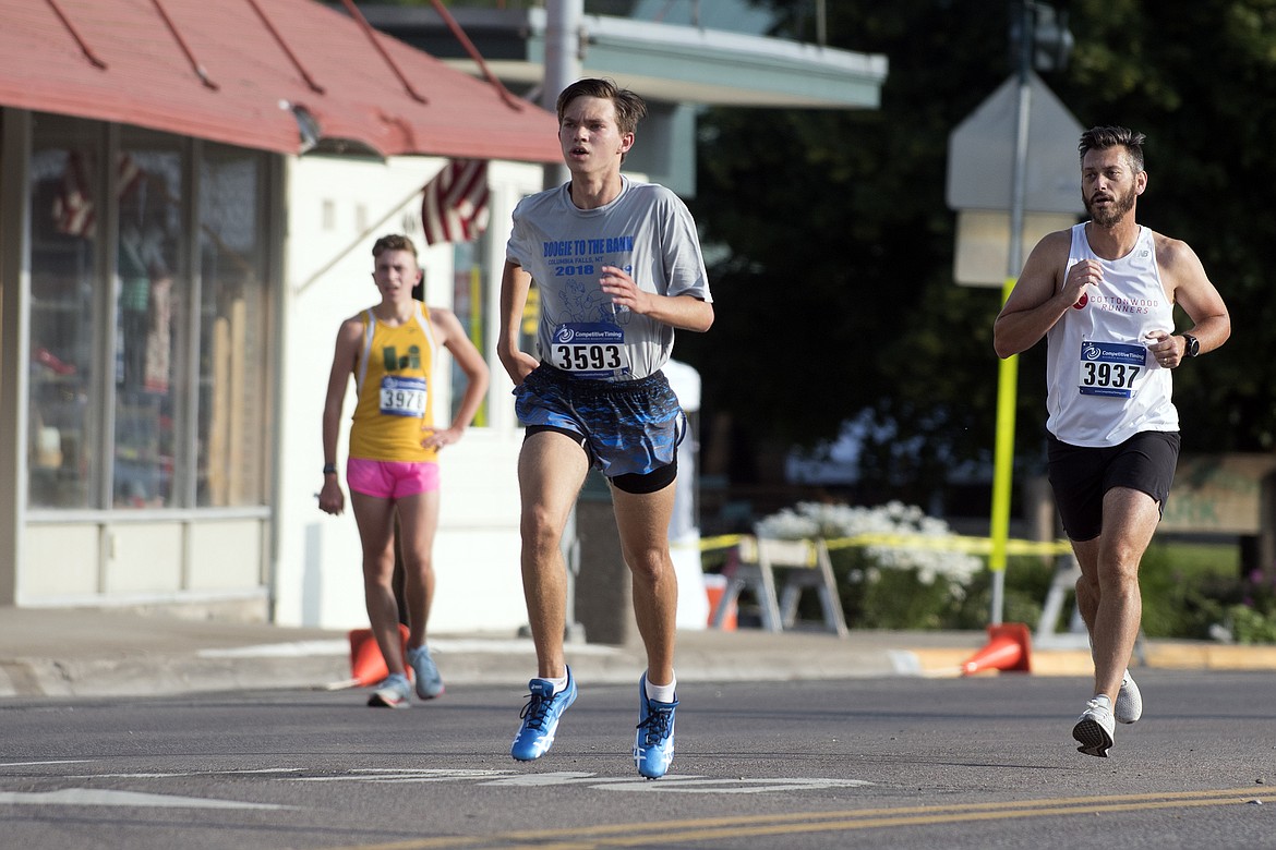 Beau Umbriaco comes down Nucleus Avenue during the Boogie to the Bank race Saturday. Umbriaco finished 12th in the 5K. (Jeremy Weber photo)