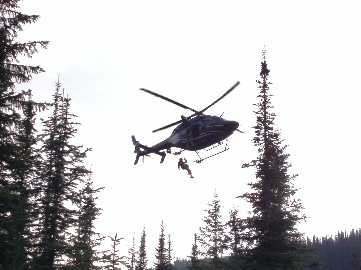 Photo by SANDY STEINHAGEN
Two Bear Air arrives to pick up the man in need of medical attention.