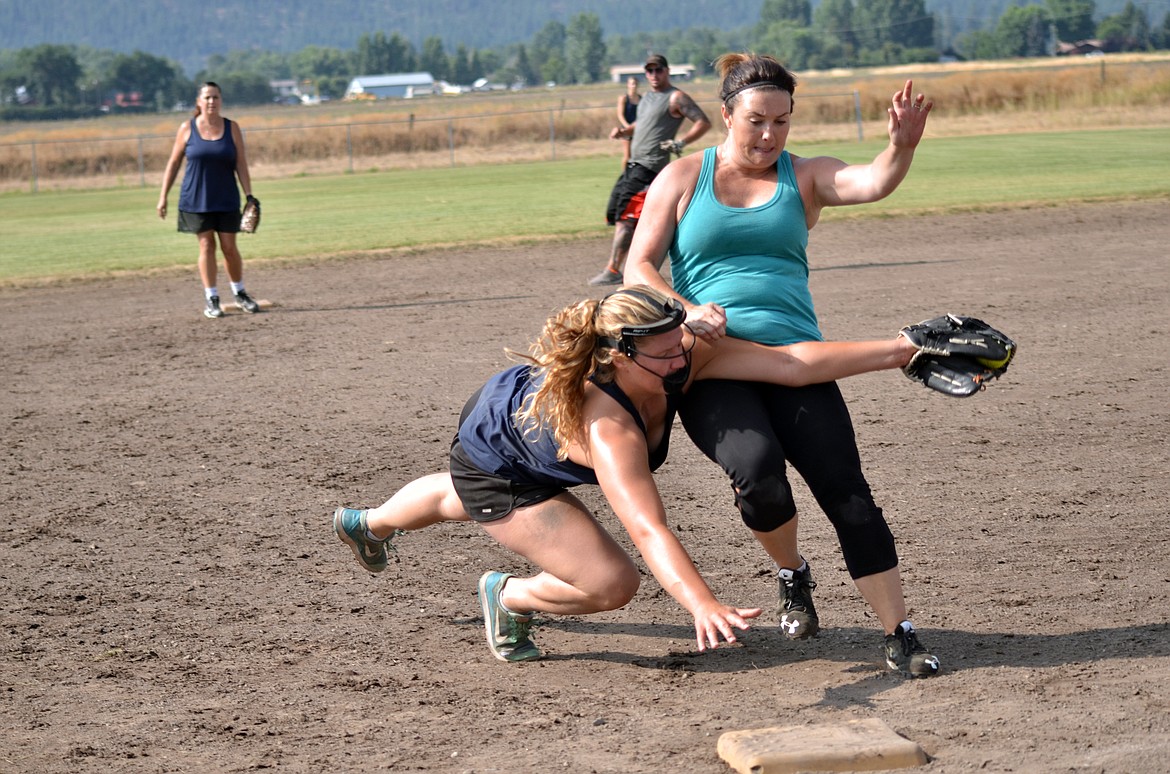 Jessica Thompson from The Printery team gets the out at third base. (Erin Jusseaume/ Clark Fork Valley Press)