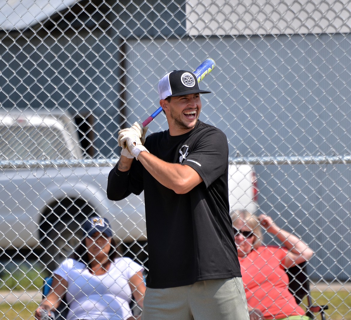 Missoula player for Kyndra&#146;s Corner Nathan Chapman was all smiles at the plate before hitting a double. (Erin Jusseaume/ Clark Fork Valley Press)