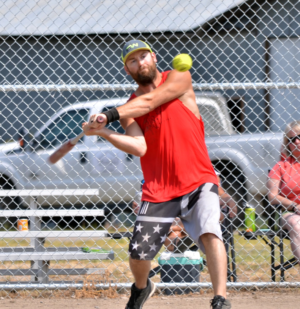 Thompson Falls player Nate Pavlik from Off in the Woods hits one over the fence during their second game helping the team grab the win. (Erin Jusseaume/ Clark Fork Valley Press)