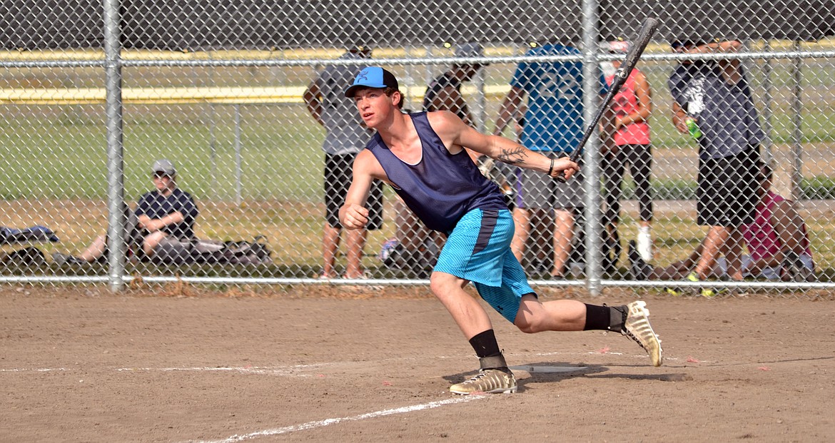 Tanner Ovitt from The Printery team hits a homer over the left field fence. (Erin Jusseaume/ Clark Fork Valley Press)