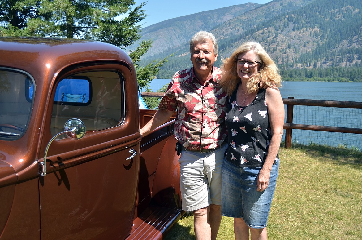 Ron and Elizabeth Petrie stand proudly next to their 1941 Ford pickup at the Cool Summer Nights Car Show in Trout Creek. (Erin Jusseaume/Clark Fork Valley Press)